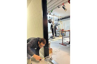 use case experiments in which different individuals interact with the stage setup called "Water Door" and playfully test their trust in an object-oriented world